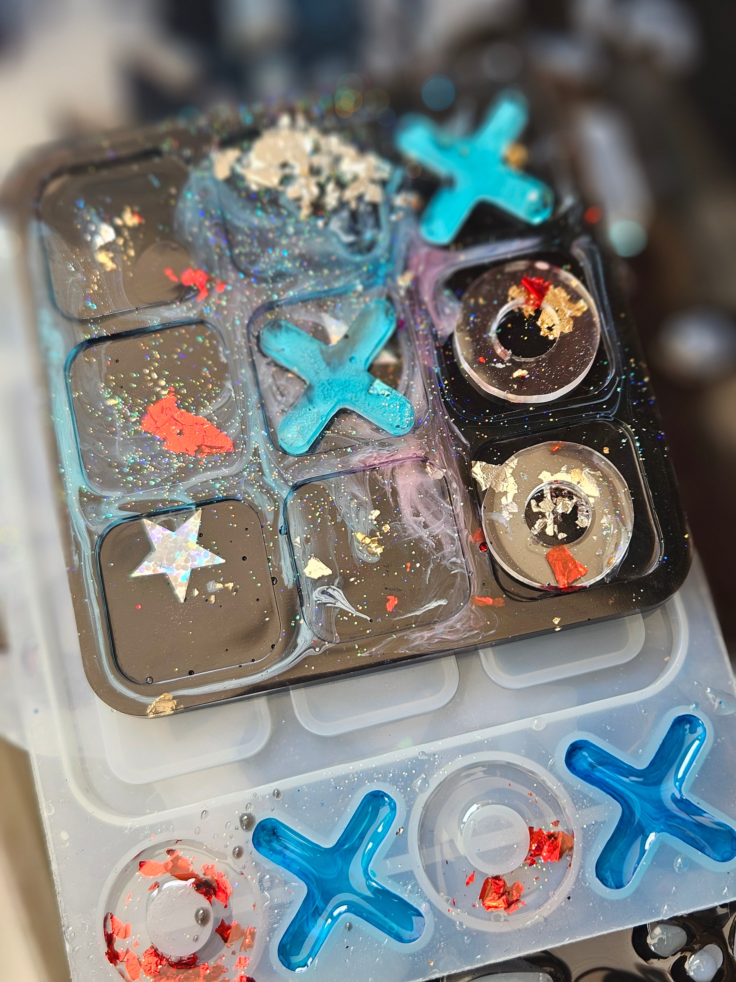 Handmade resin noughts and crosses game