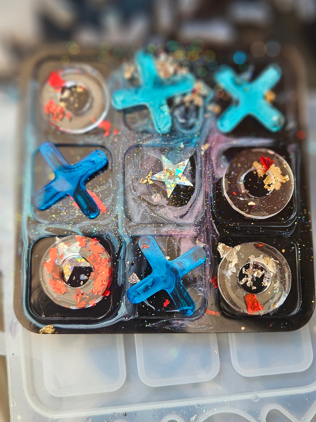 Handmade resin noughts and crosses game