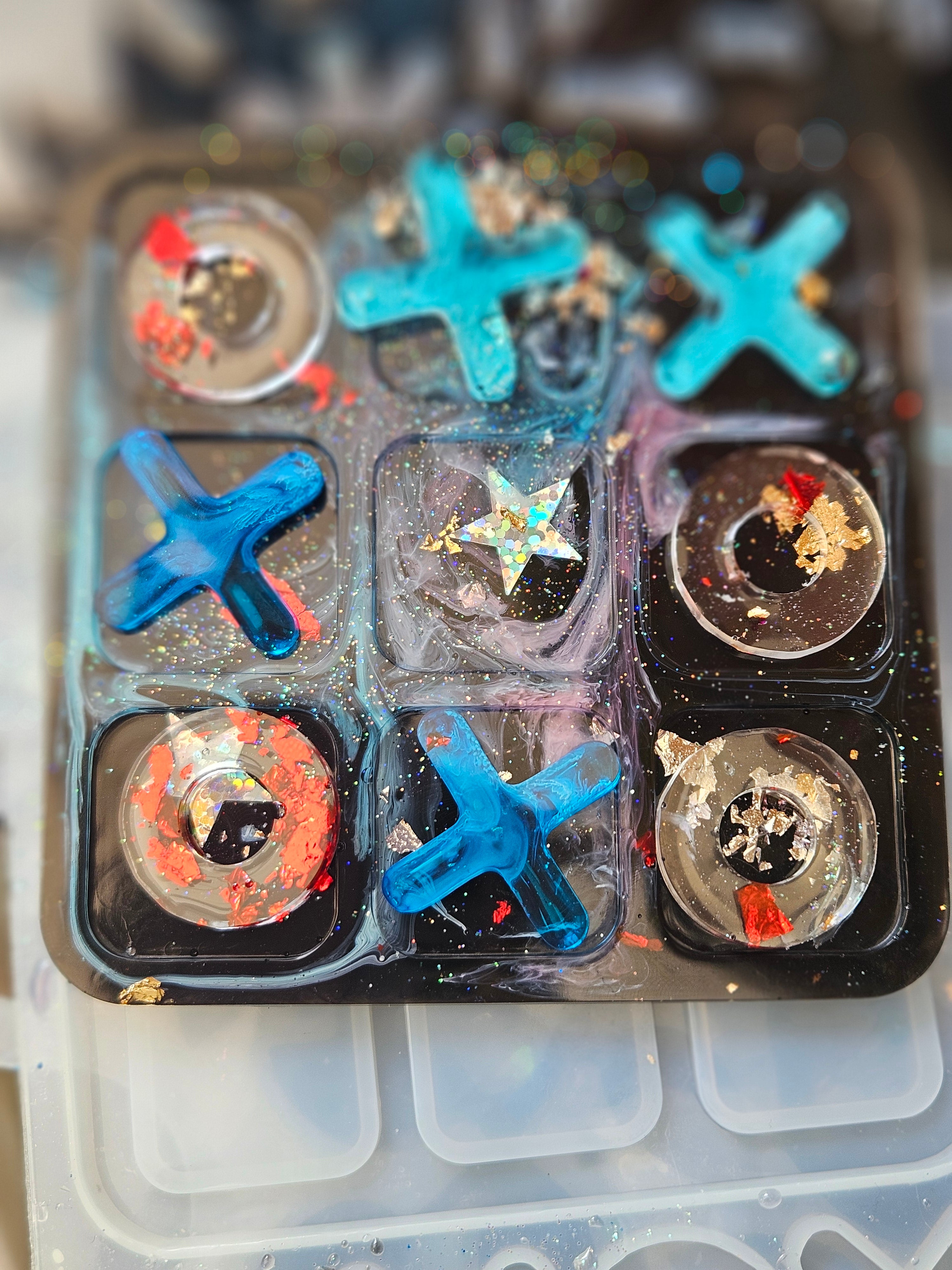 Handmade resin noughts and crosses game