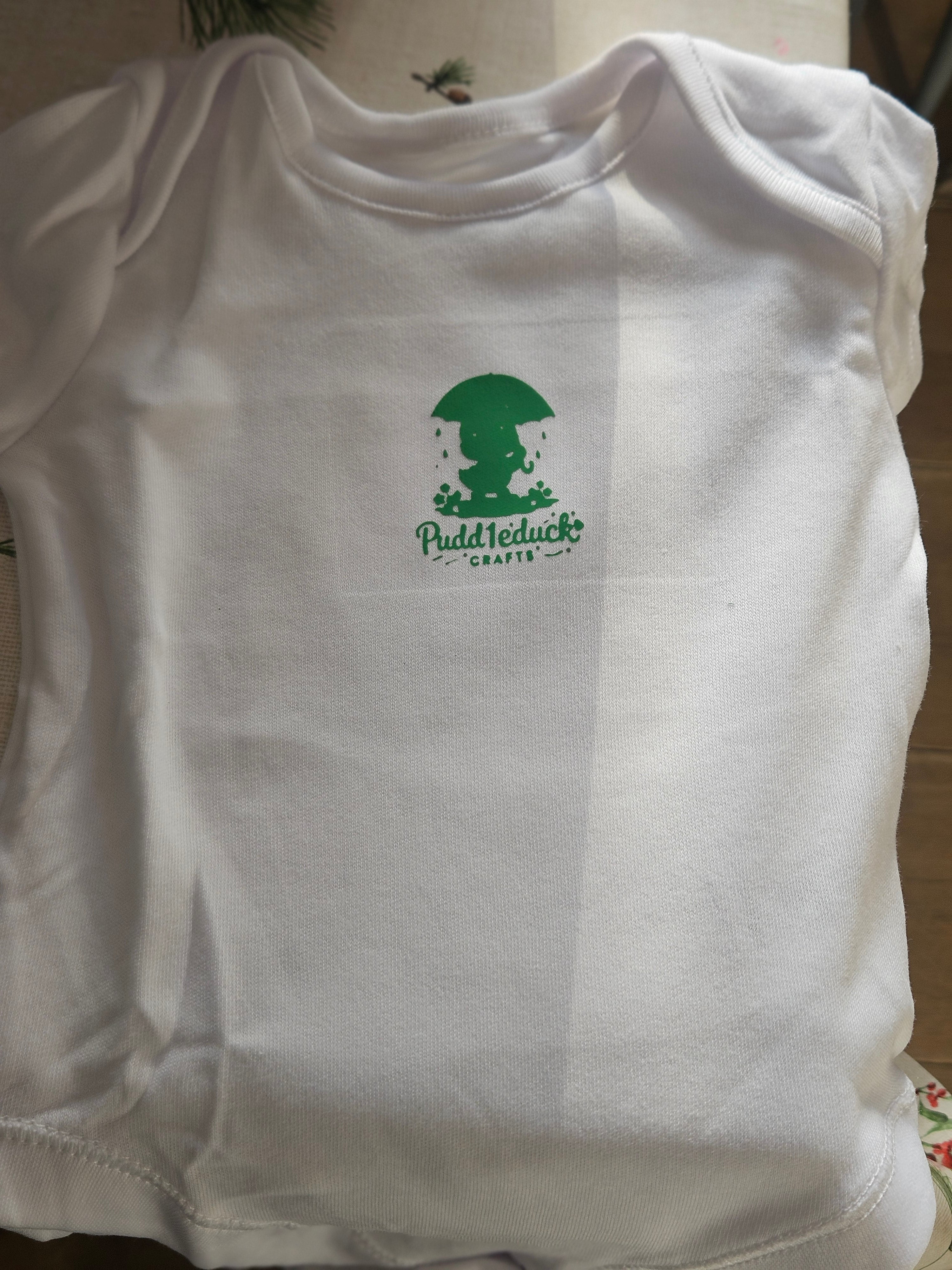 New logo'd baby vests with brand name