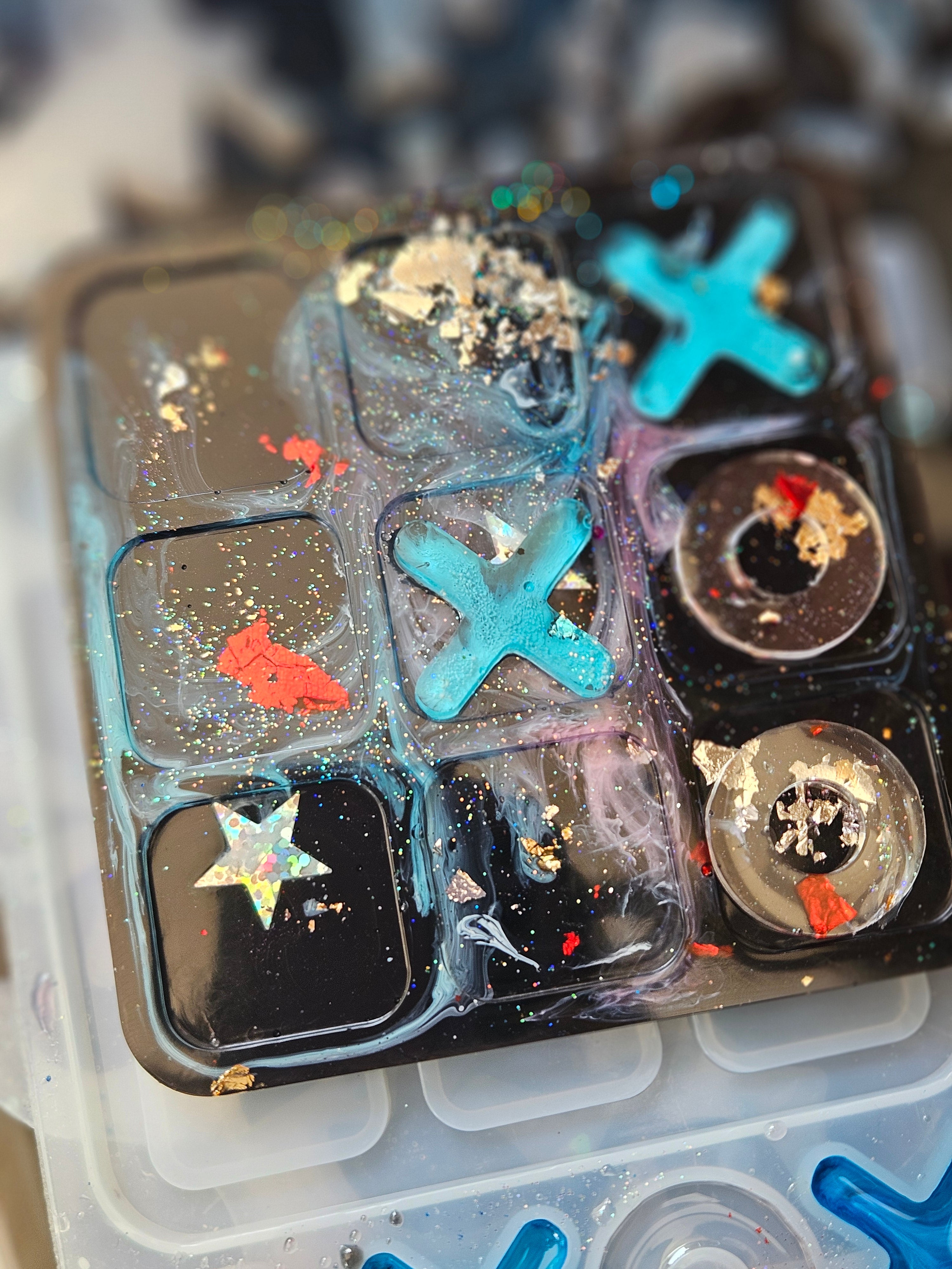 Handmade resin noughts and crosses game