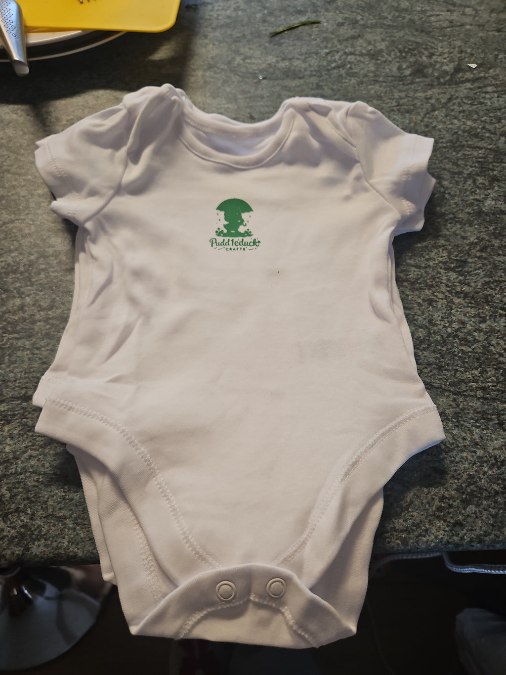 New logo'd baby vests with brand name